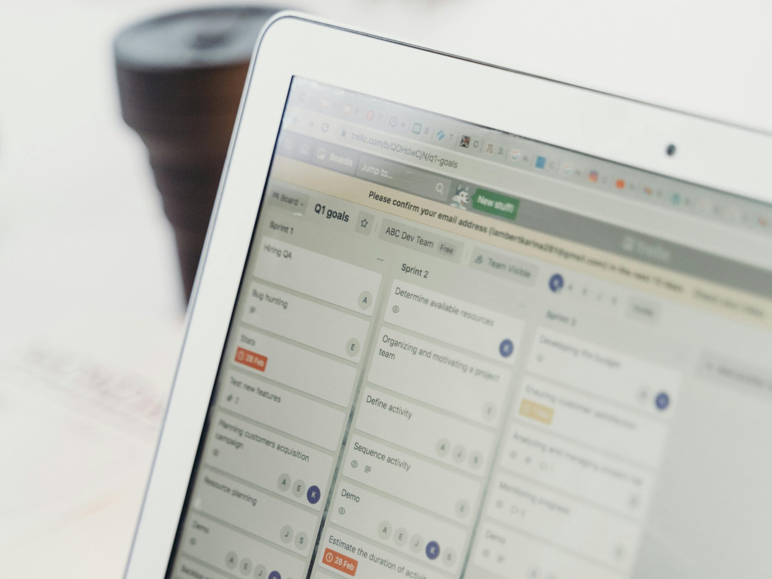 Close-up of a laptop screen showing project management software interface. Perfect for business or tech themes.